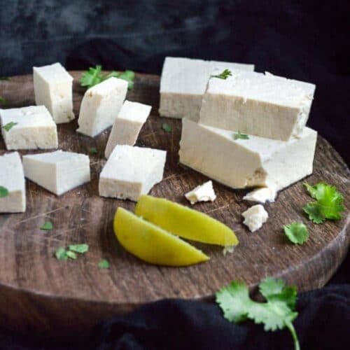 Tofu pieces on wooden plate