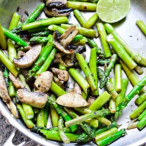 Sauteeing mushrooms and asparagus image