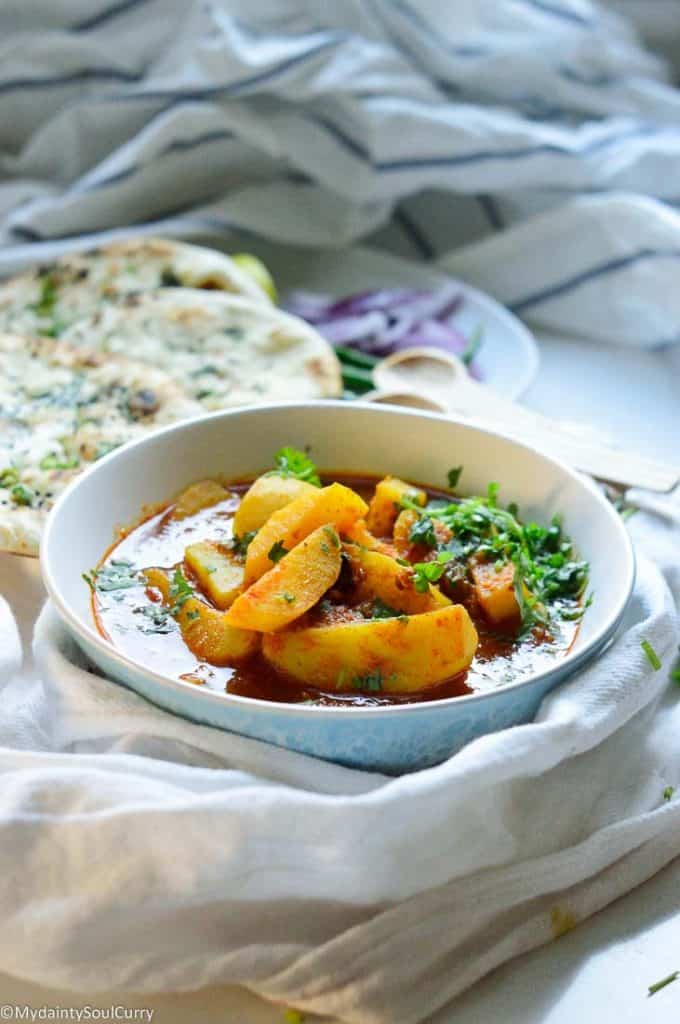 Curried potatoes in tomato sauce