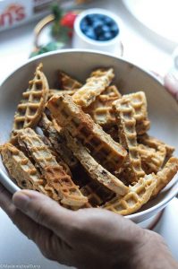 Tossing waffle sticks with cinnamon sugar