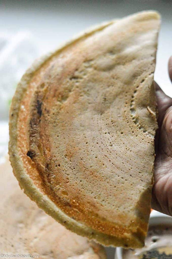 a piece of adai dosa