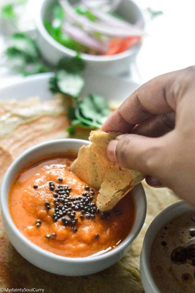 A bite of mixed dal dosa