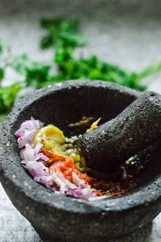 mashing eggplant for baigan choka