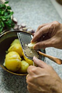 Adding garlic to aloo Choka