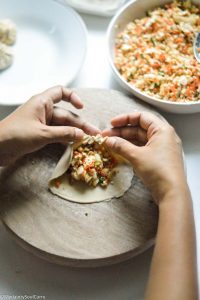 pleat the edges of dumplings