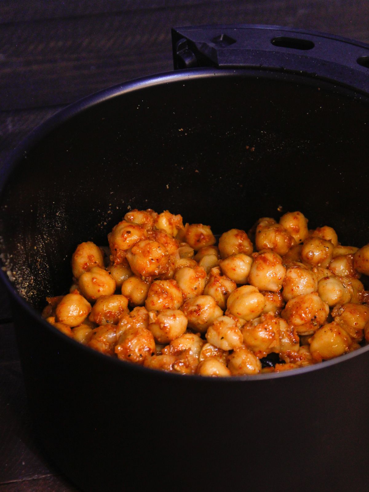 Transfer the chickpeas from the bowl to air fryer and cook well until its crunchy