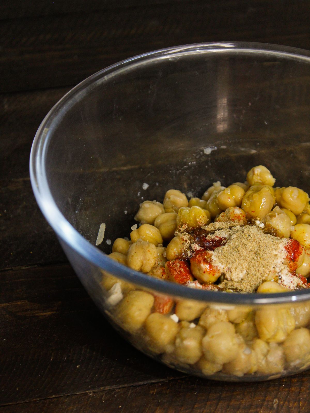 Add Chaat masala and oil to the bowl