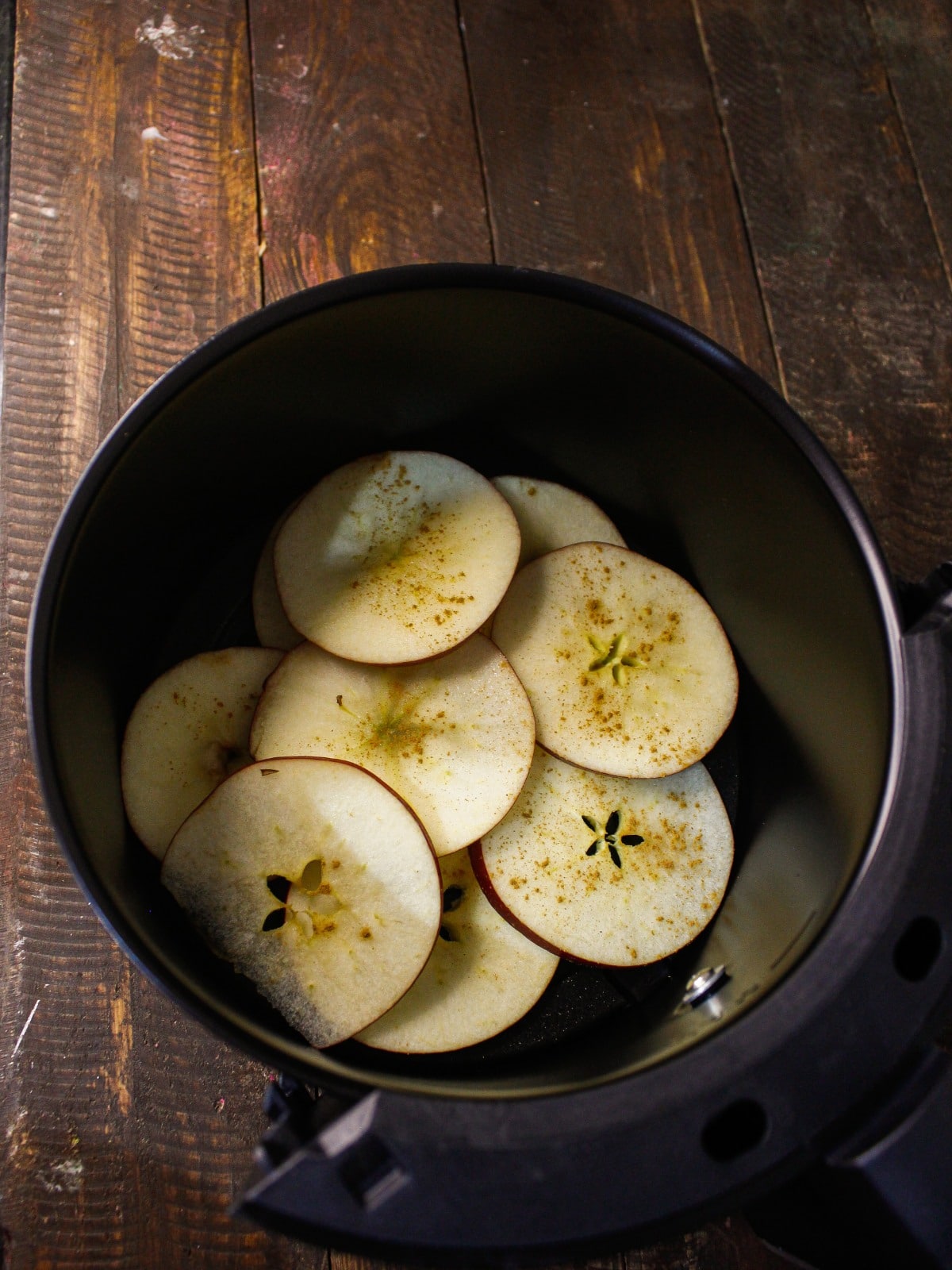 Place all the apples slices in the fryer basket