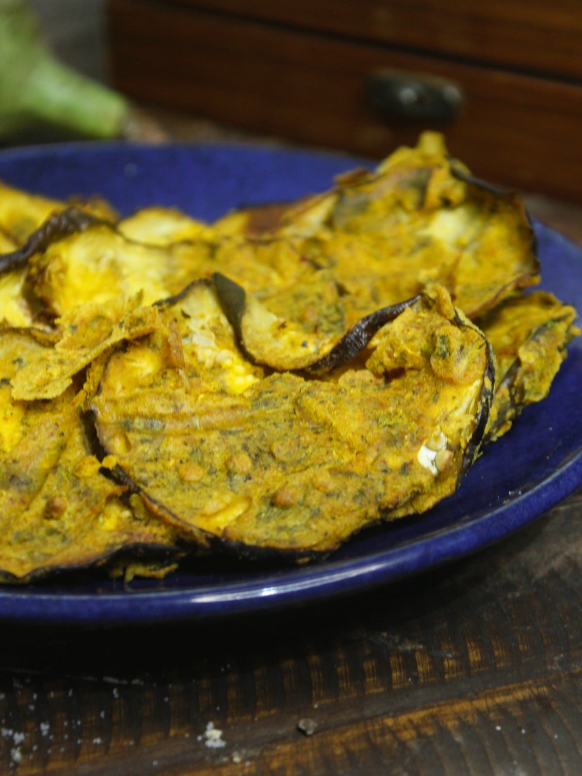 Side view of Begun Bhaja: Crispy Fried Eggplant