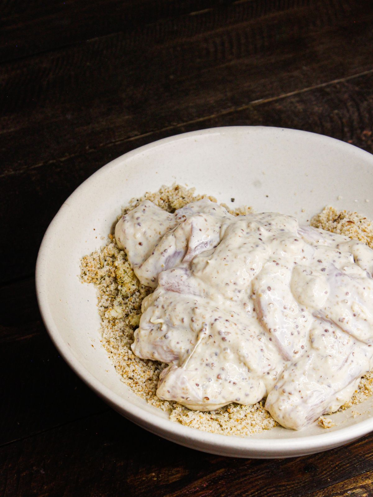 Transfer chicken mixture into the breadcrumbs mixture