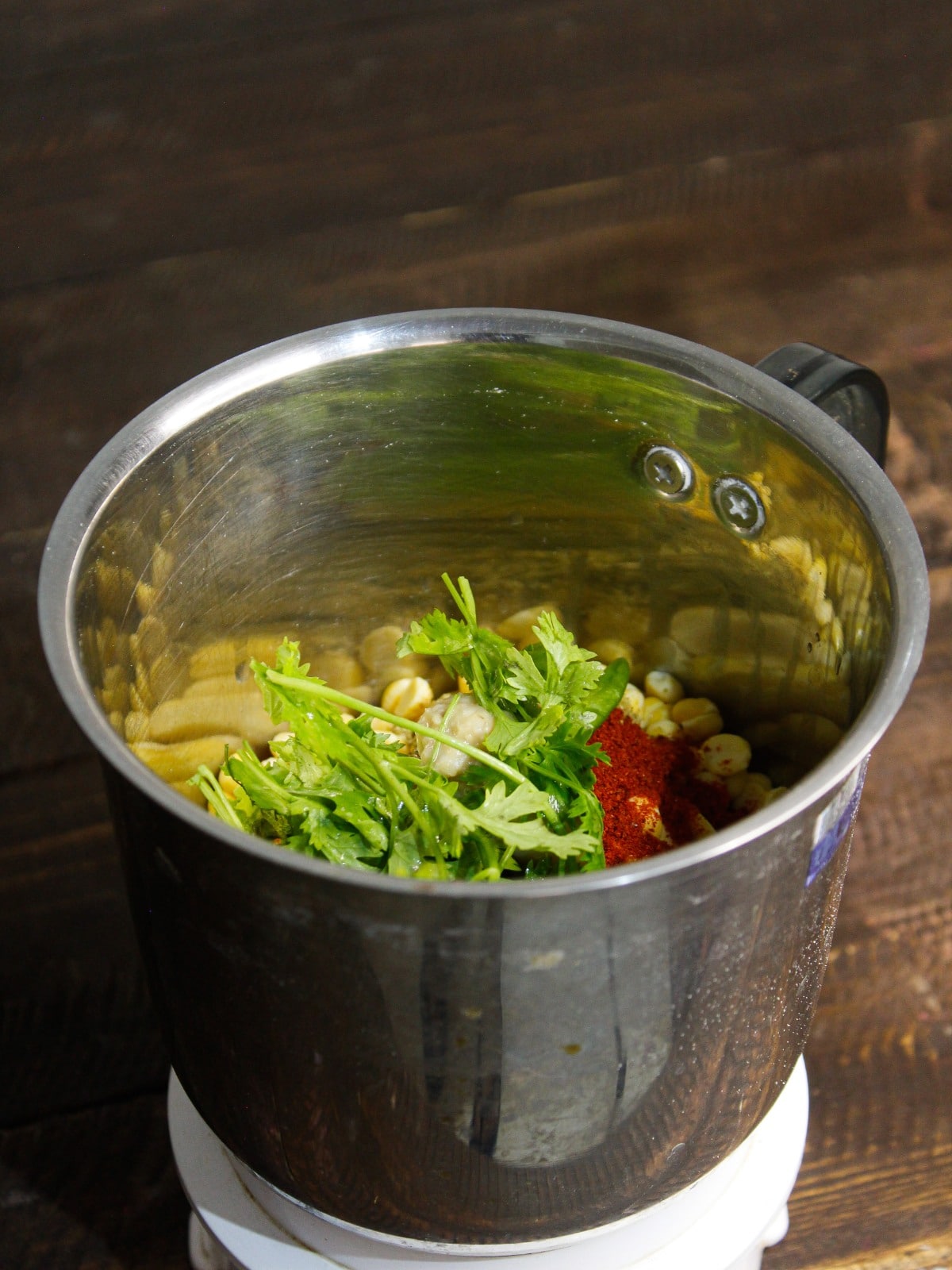 Add coriander leaves into the blender.