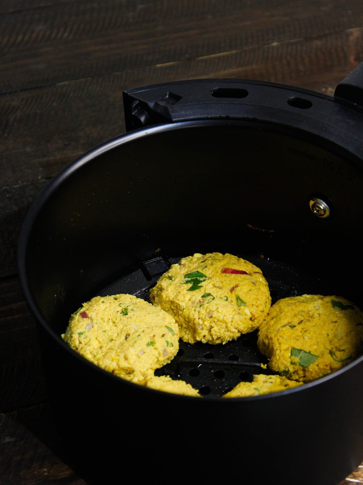 Make small small vadas out of the mixture and then place it into fryer basket and cook