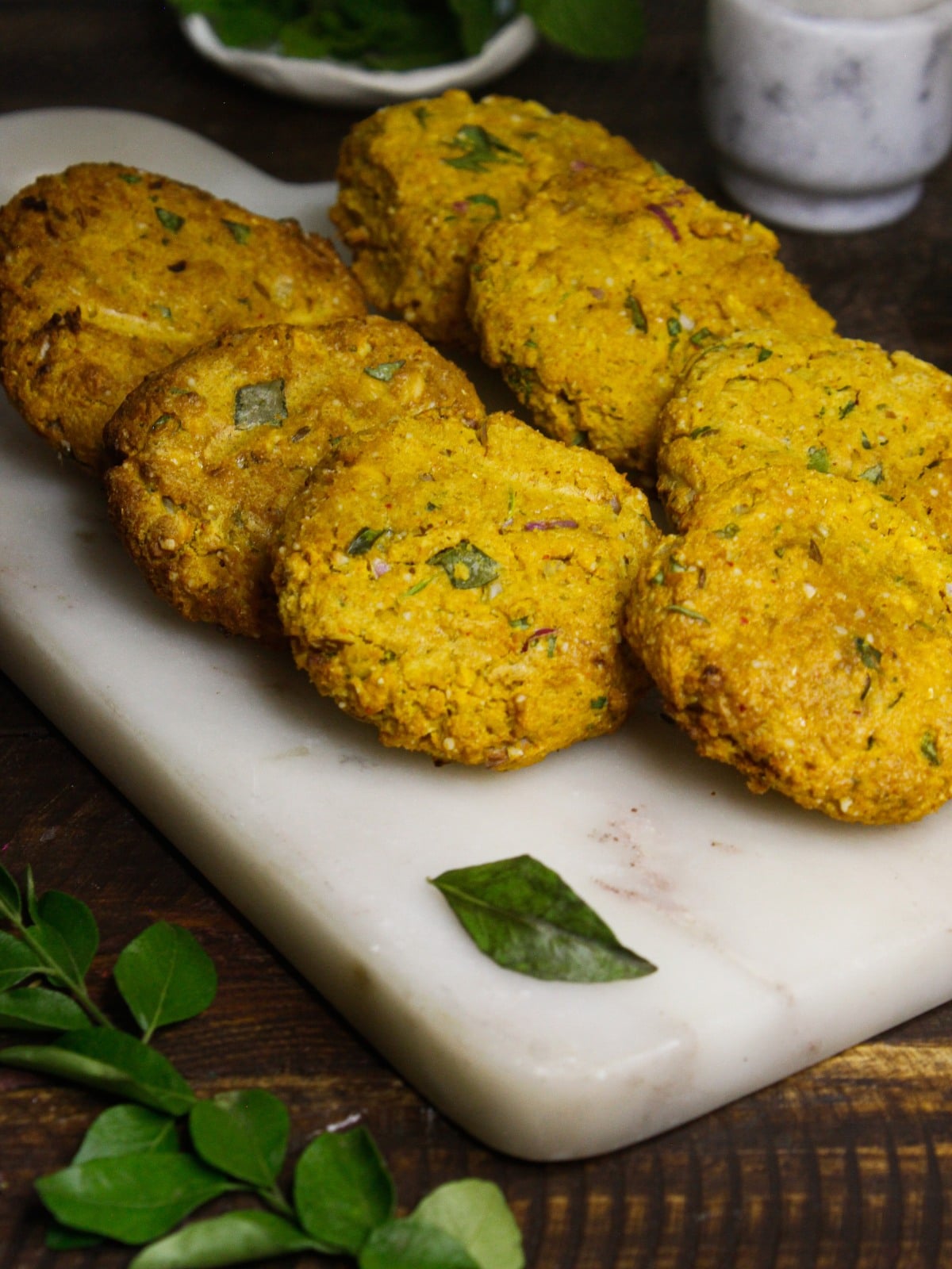 Dal Vada with Green Chutney: Indian Chickpea Fritters served with mint leaves