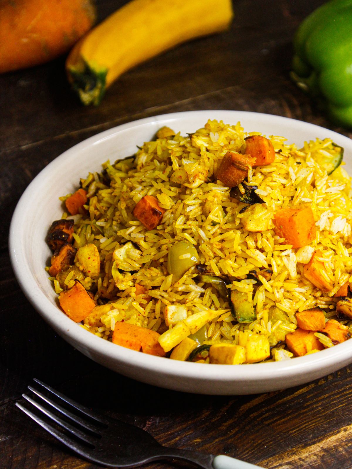 Hot and spicy yummy Easiest Vegetable Fried Rice with raw vegetables in the background