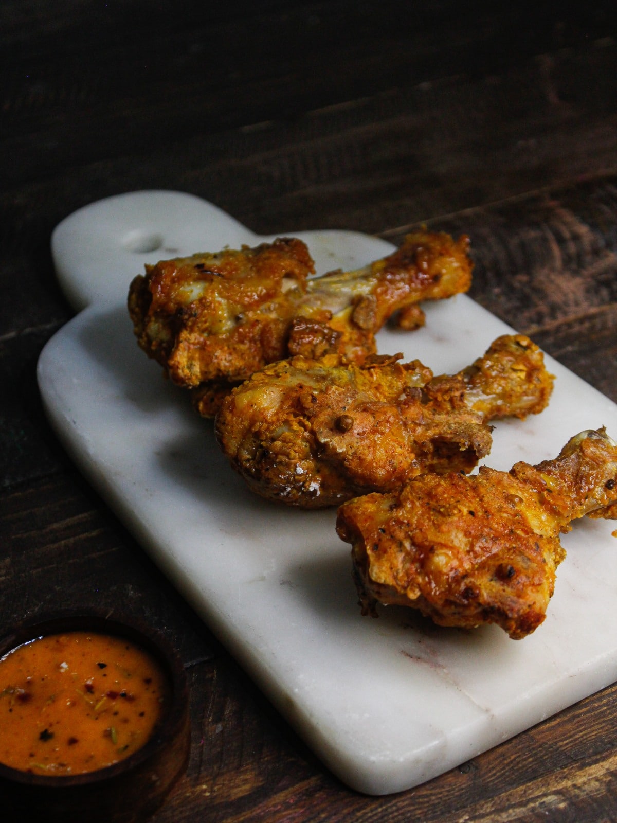 Yummy Spicy Fried Chicken Drumsticks ready to enjoy with spicy chutney