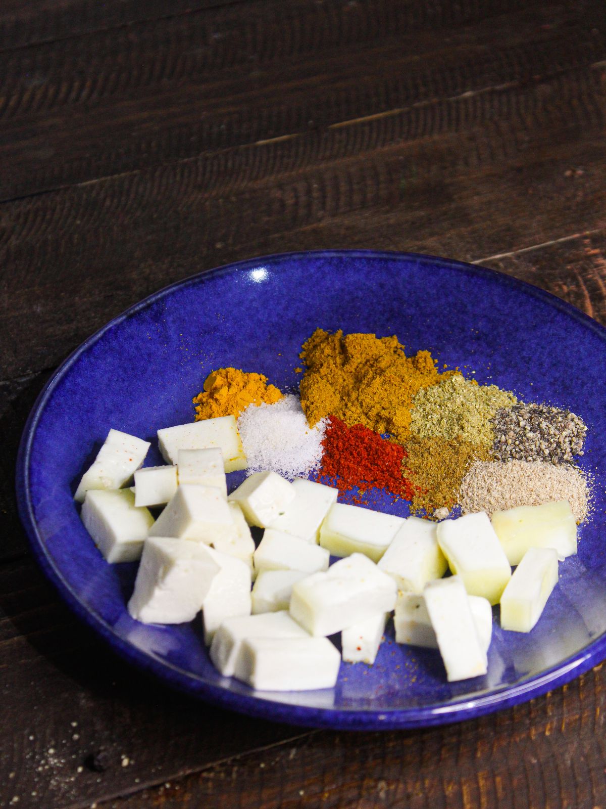 Add paneer cubes along with all the spices in a plate