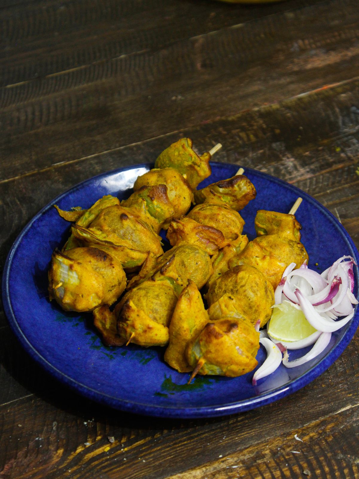 Serve hot and spicy Tandoori Potatoes With Green Chutney and onions