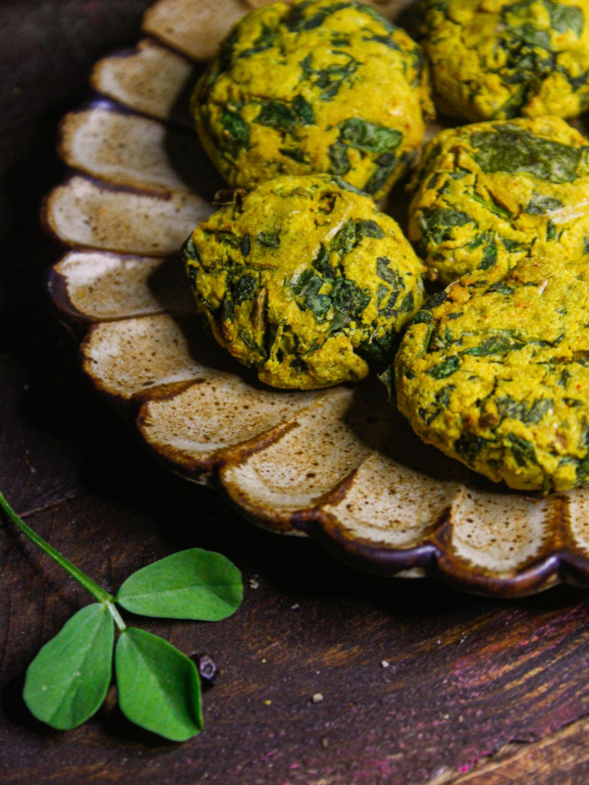 Side view image of Air Fried Fenugreek Pakoras With Green Chutney