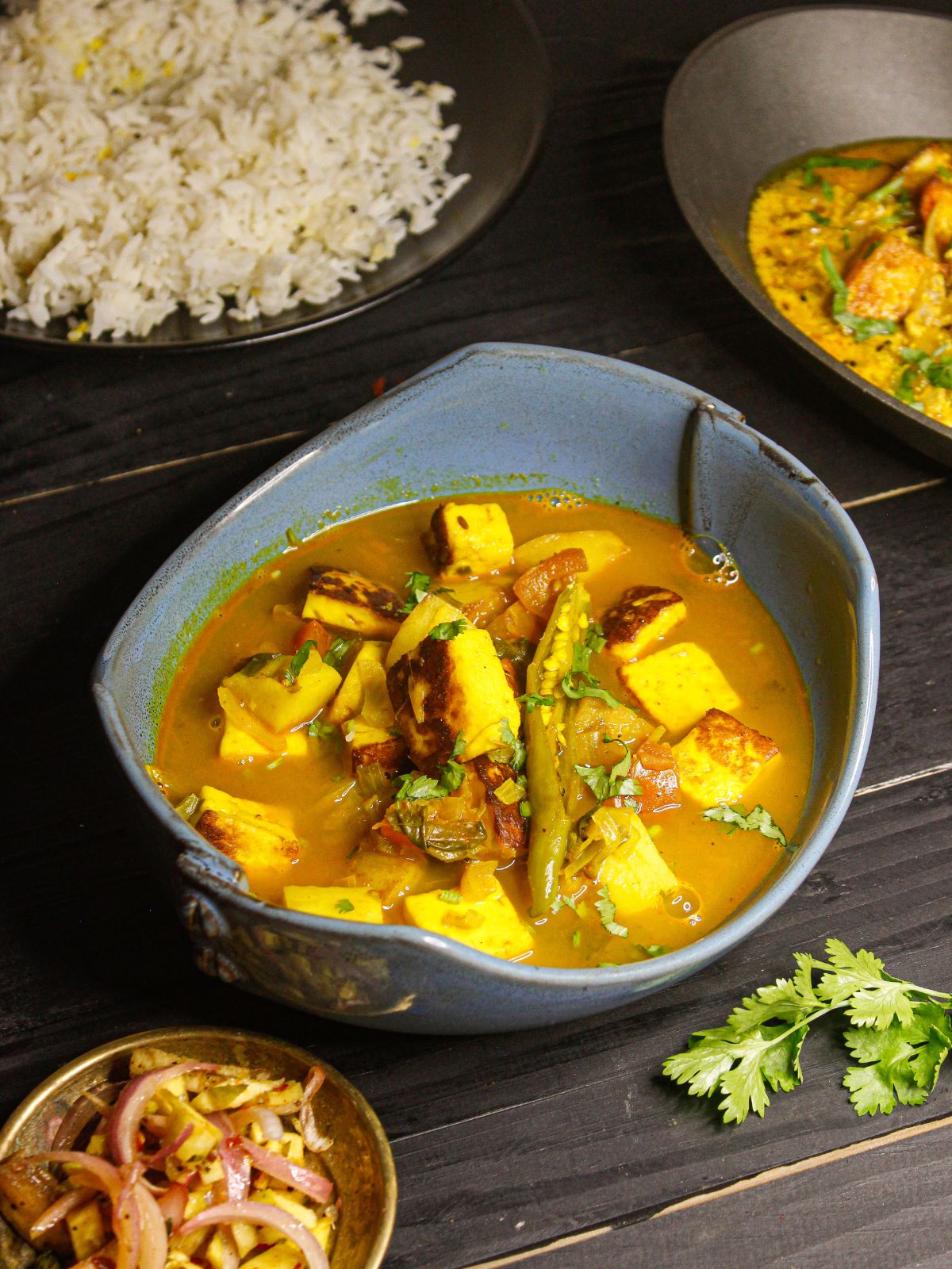 Instant Pot Aloo Paneer Gravy served with rice and onion salad