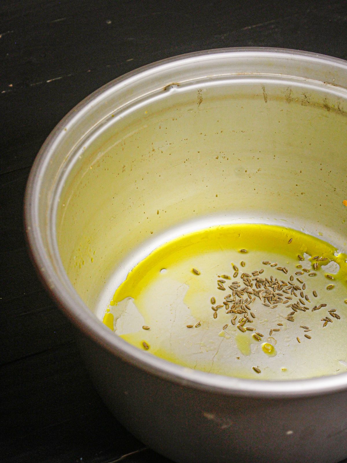 Add some cumin seeds to the pot