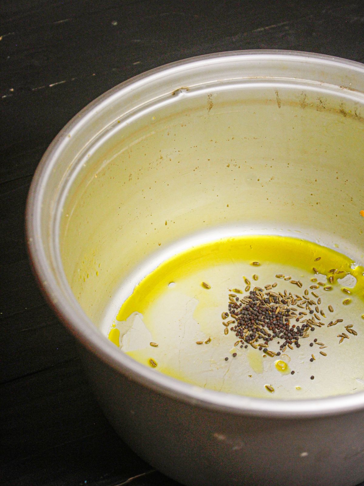 Add some mustard seeds to the pot