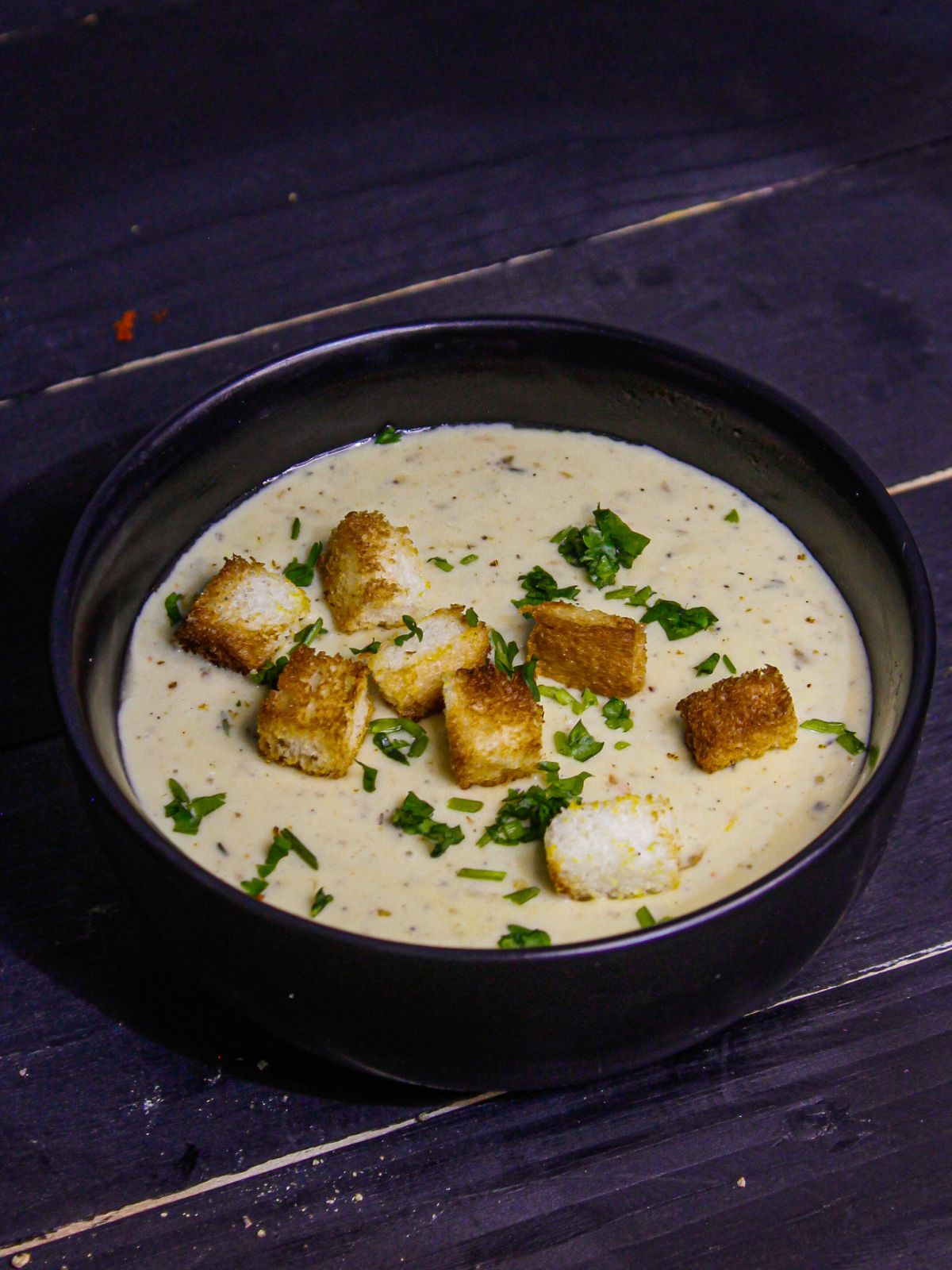 Yummy Instant Pot Creamy Cauliflower Soup served with Croutons and coriander leaves  