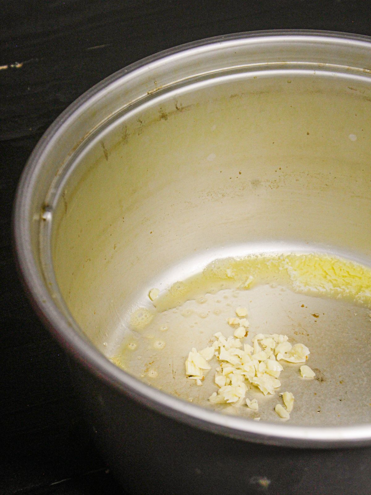 Add chopped garlic to the pot