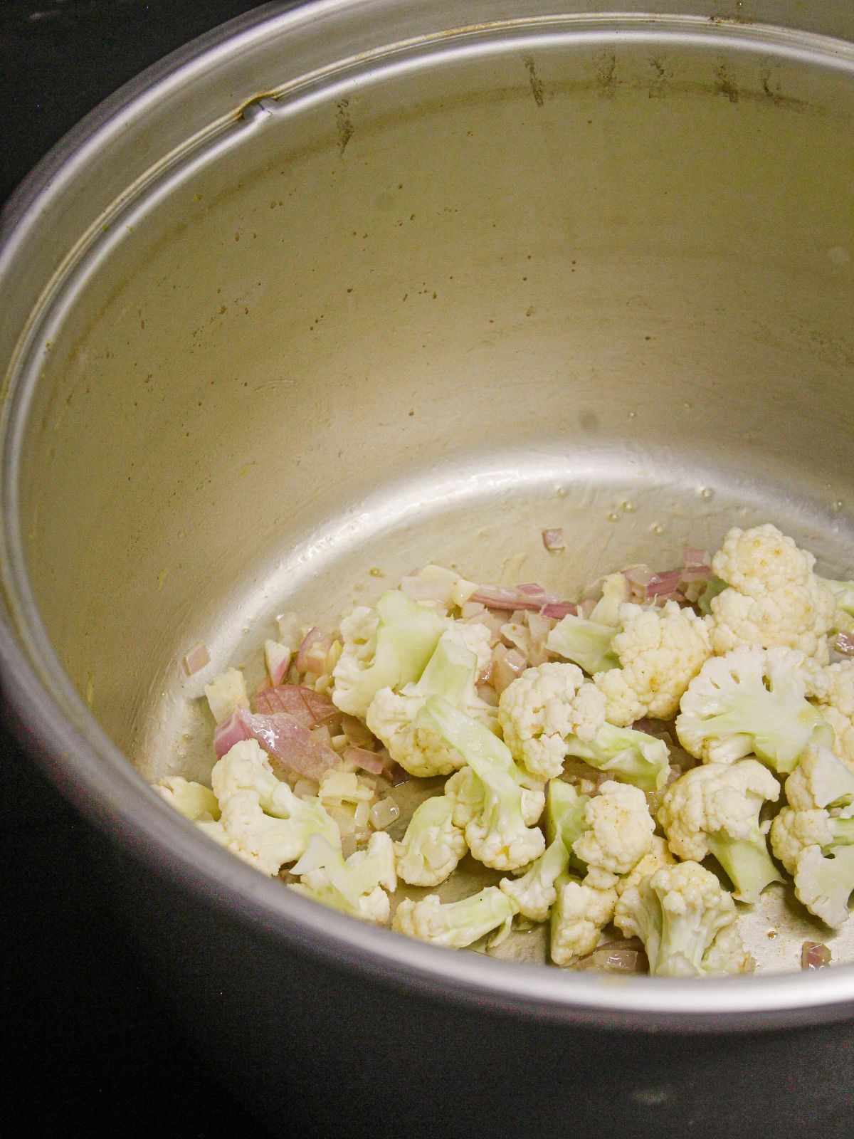 Add chopped cauliflower to the pot 