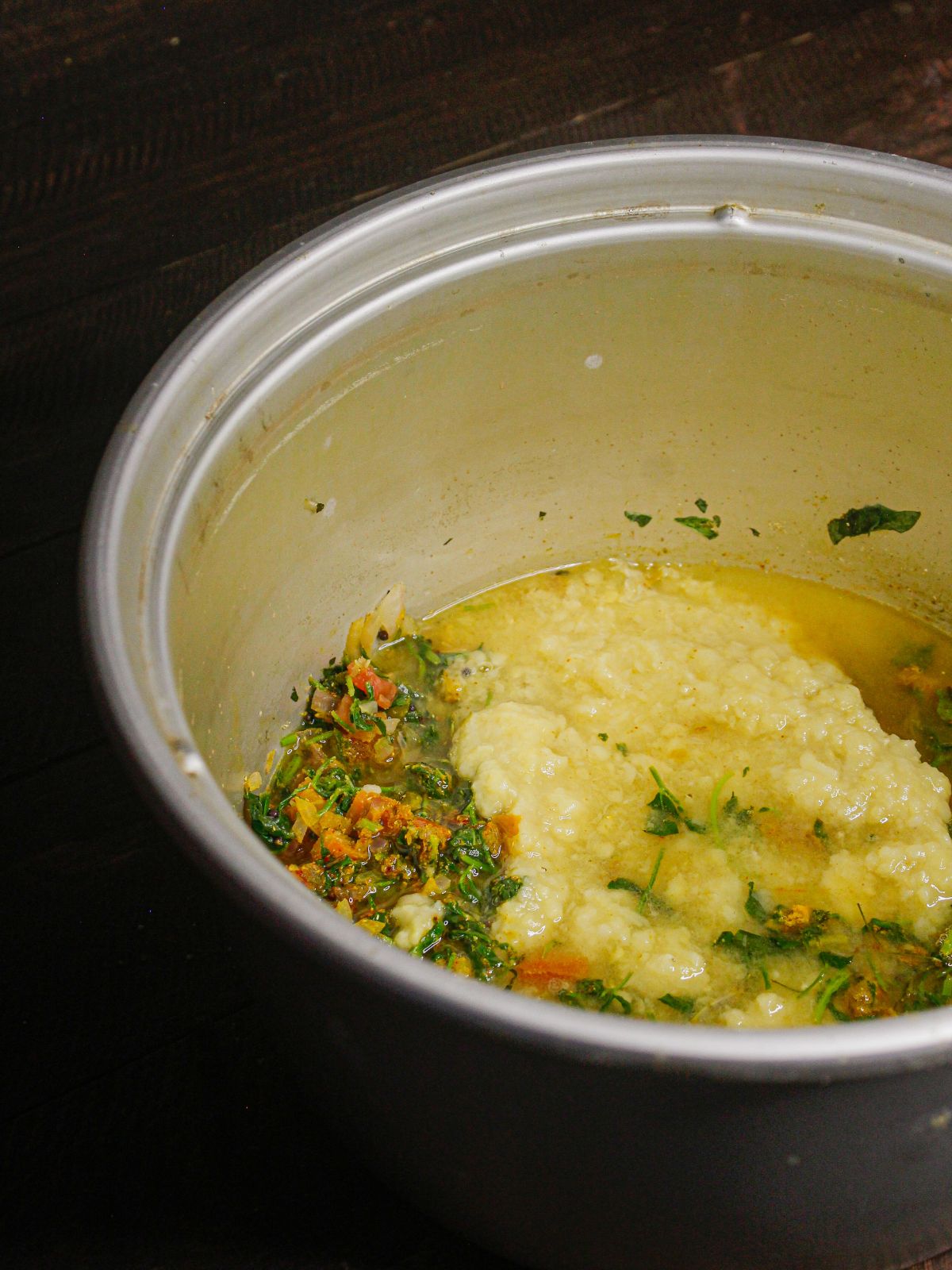 Now add boiled lentils with water in the pot