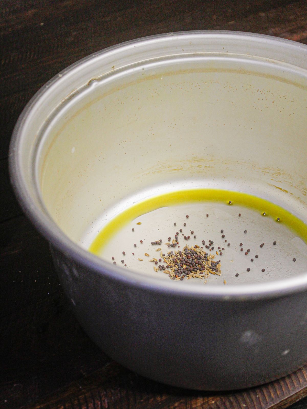 Add mustard seeds to the pot 