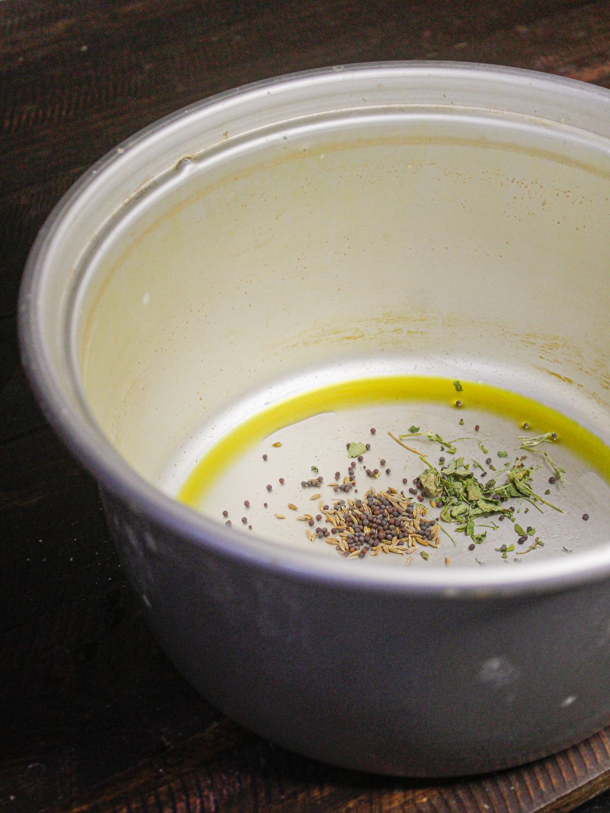 Add fenugreek seeds to the pot 