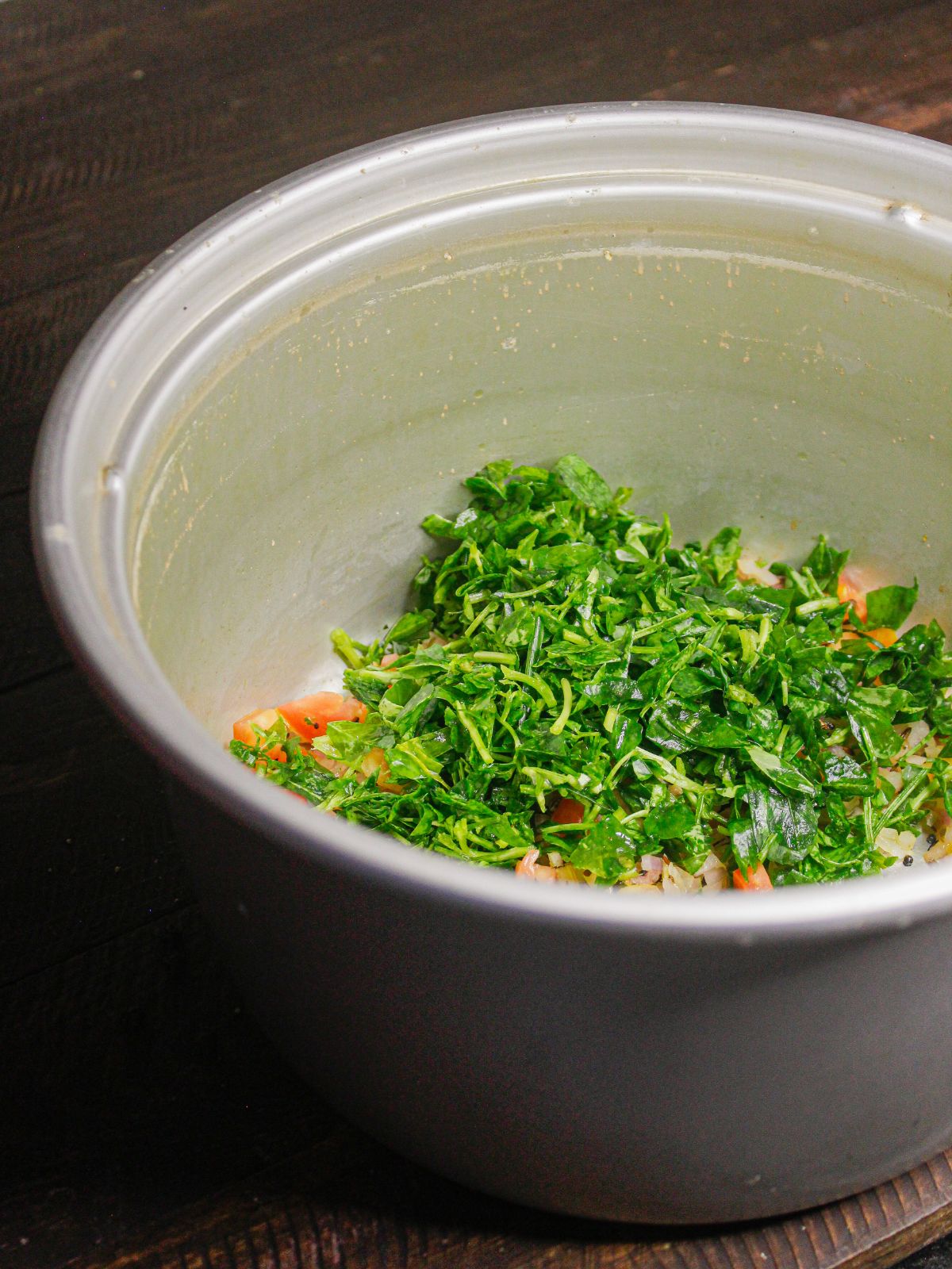 Add chopped fenugreek leaves to the pot  
