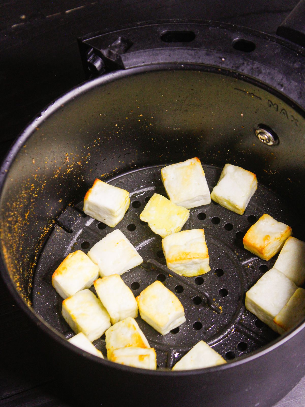 Add paneer cubes in air fryer and cook them and keep aside  