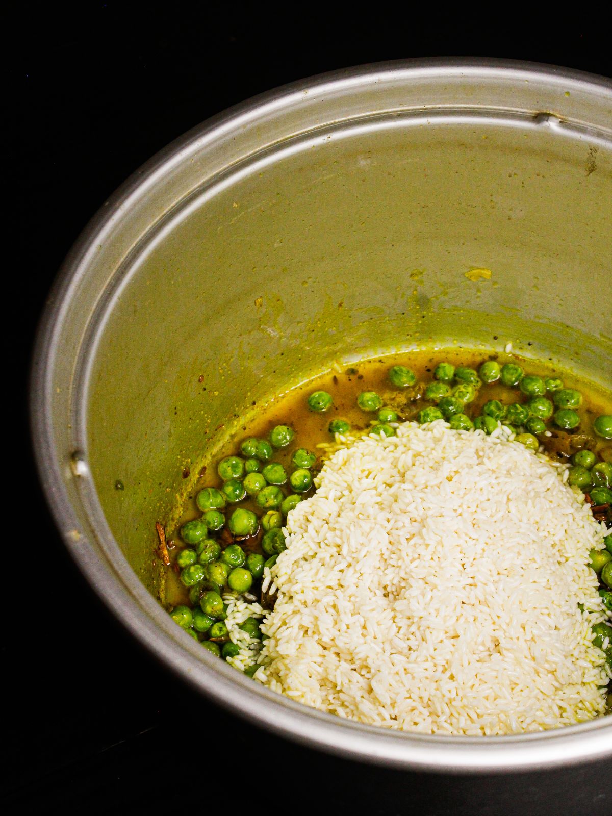 Add boiled rice to the pot 