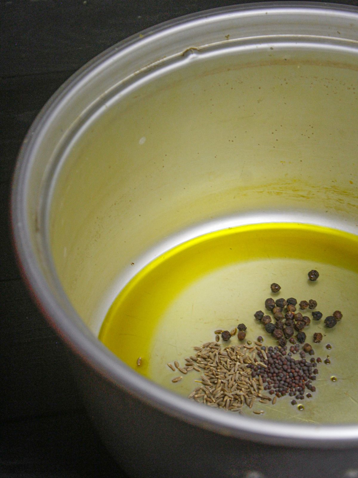 Add cumin seeds, black pepper and mustard seeds to the pot and saute 