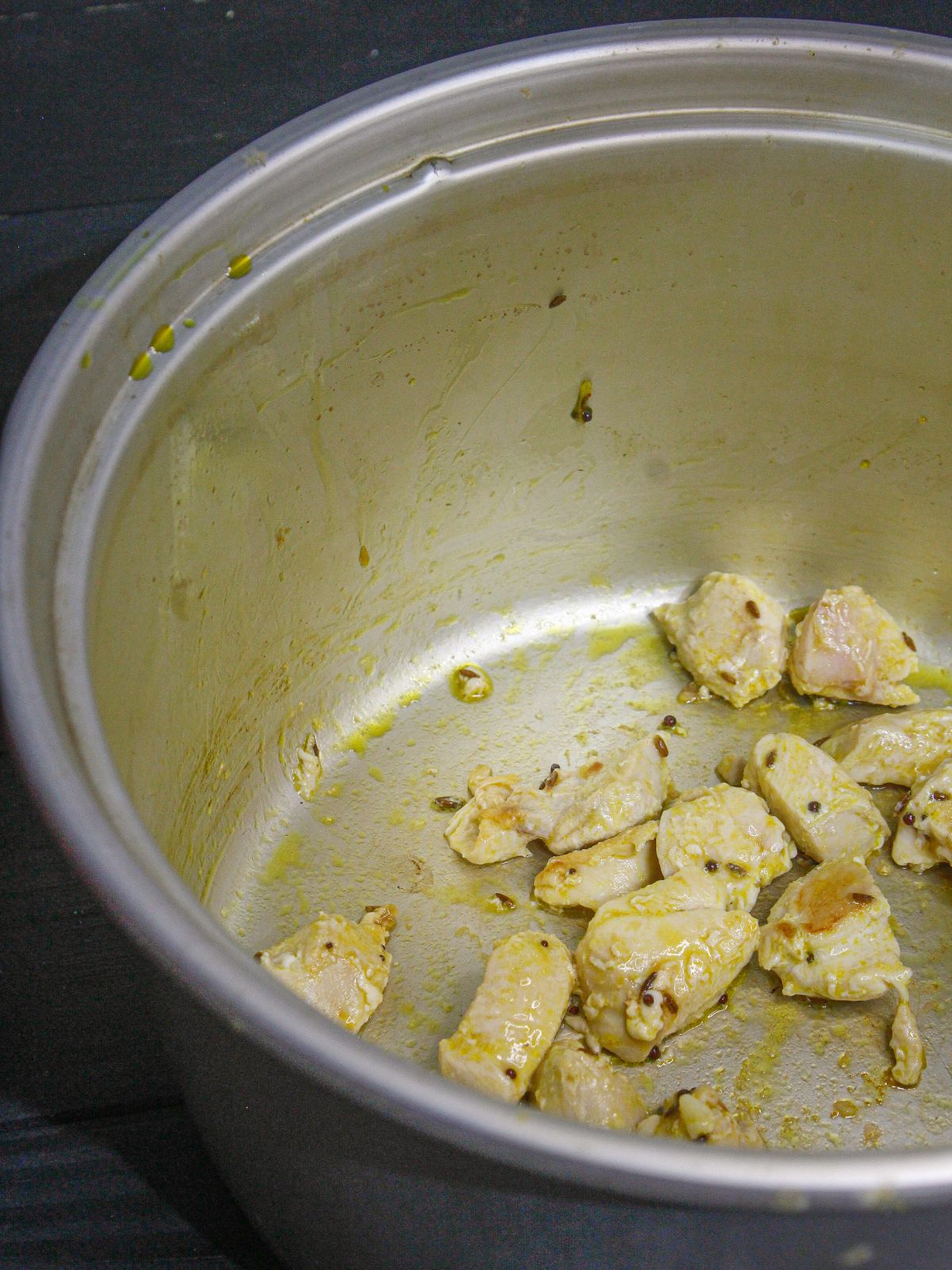 Add chicken pieces in to the pot and saute well