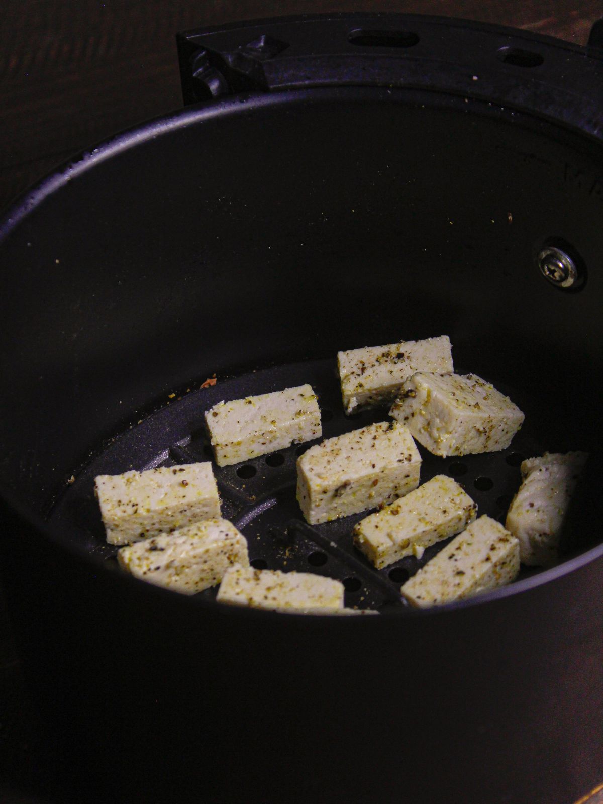 Transfer tofu into air fryer and cook well
