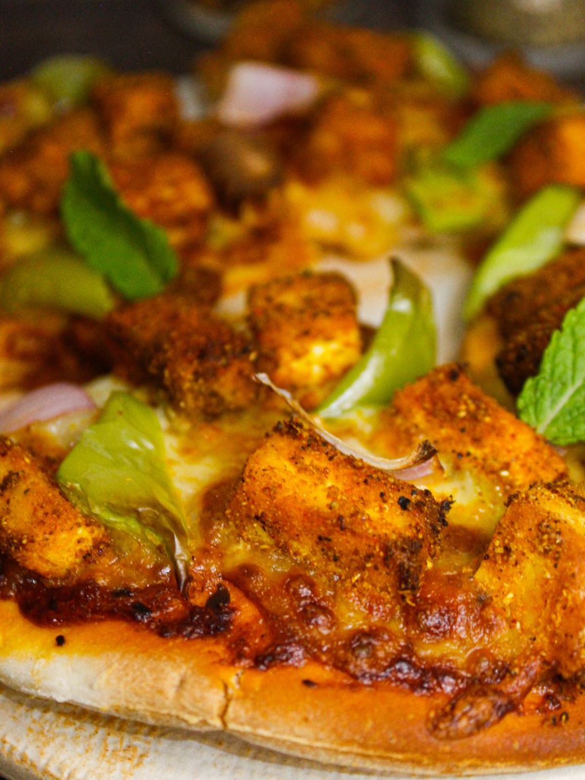 Yummy slice of Tandoori Paneer Pizza