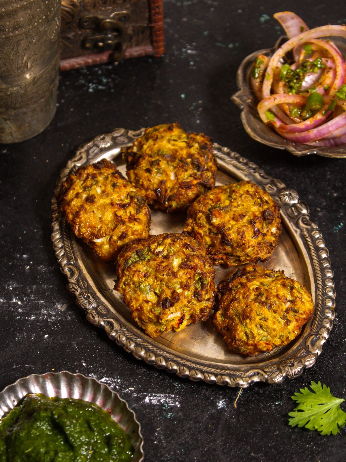 Crunchy and spicy Air Fried Chapli Kebab with Green Chutney and Salad ready to enjoy with tea 