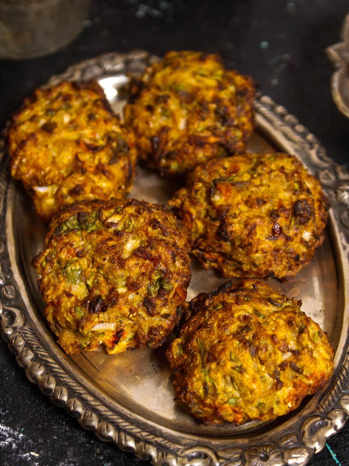 Top view image of Air Fried Chapli Kebab with Green Chutney and Salad