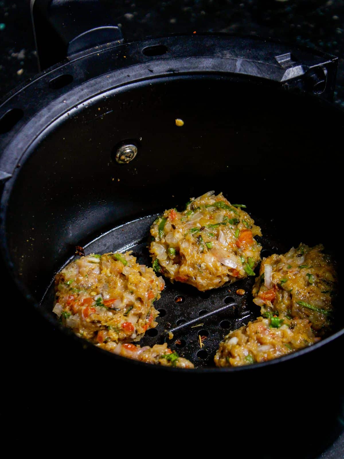Transfer the kababs into air fryer and cook well 