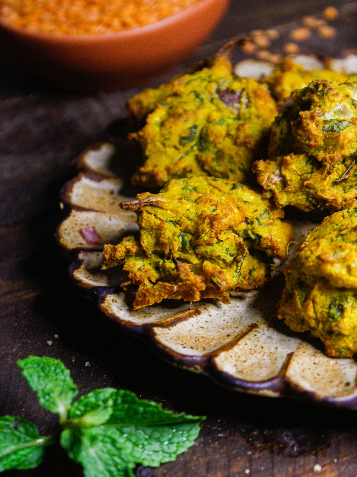 Side view image of Air Fried Lentil Fritters with Tamarind Chutney