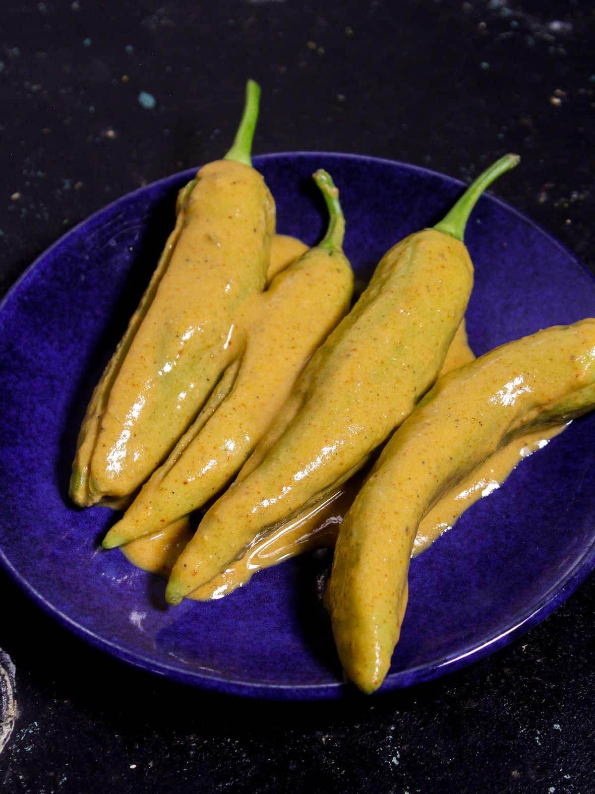 Coat the chilies properly with the besan mixture 