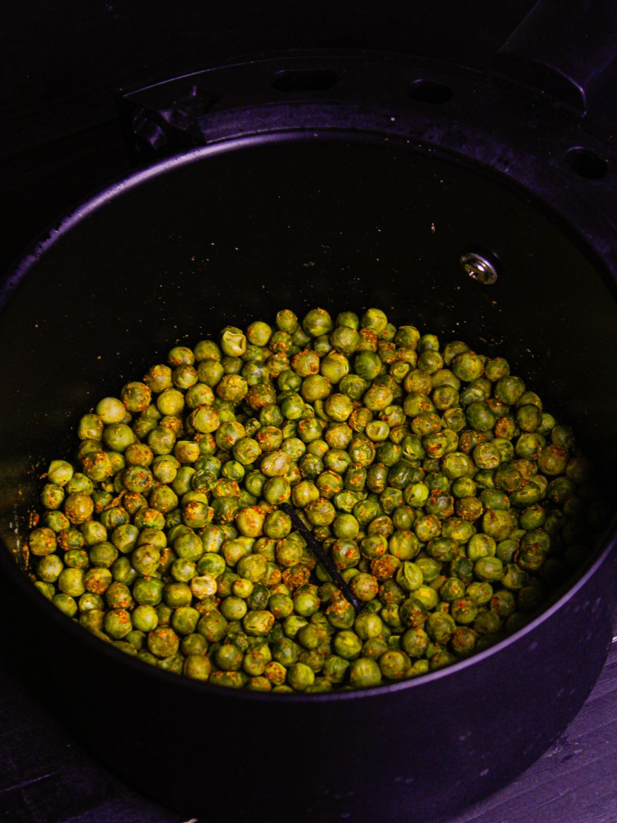 Keep shaking the peas until everything is cooked well 