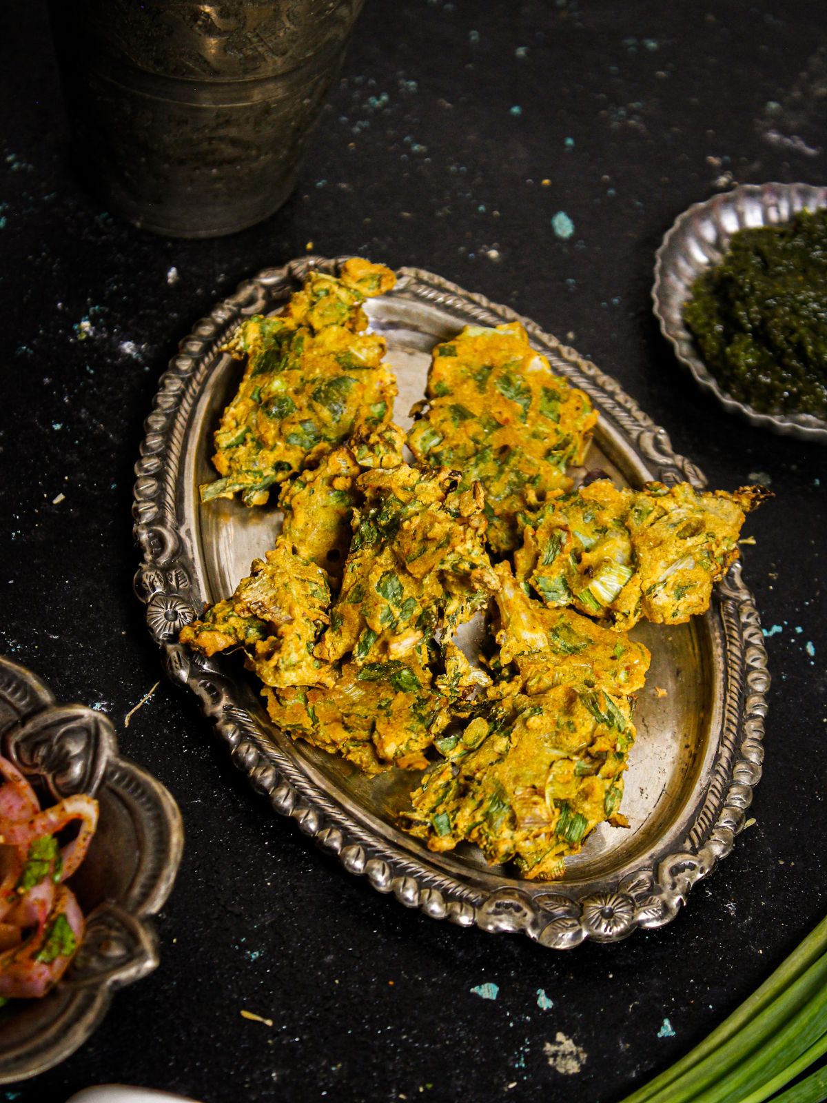 Top view image of Air Fried Spring Onion Pakoras with Green Chutney and Salad