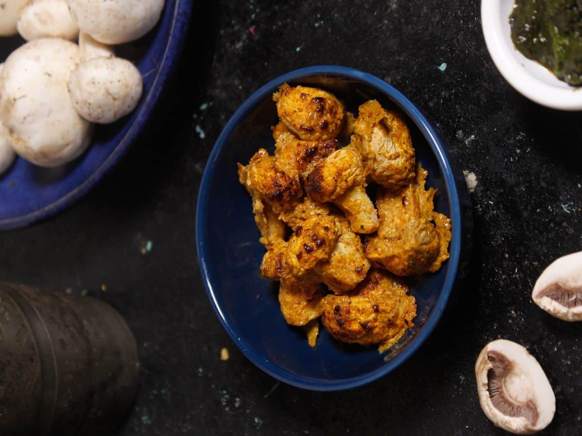 Top view of Air Fried Tandoori Mushrooms with Green Chutney