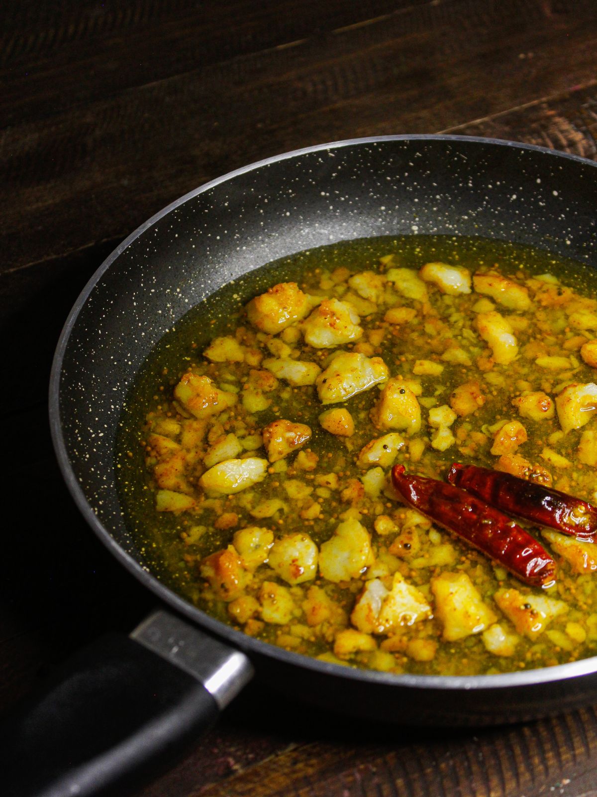 Add water to the potato mixture and cook well