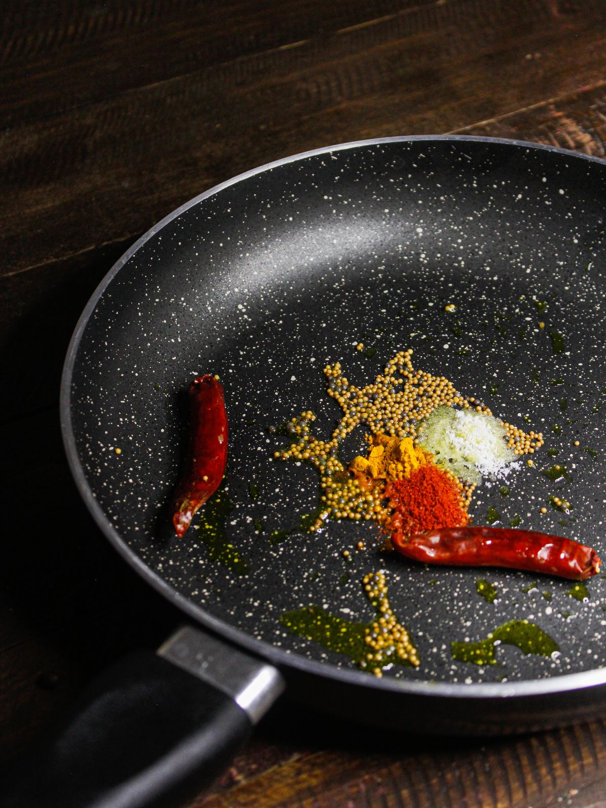 Add powdered spices to the pan and sauté well