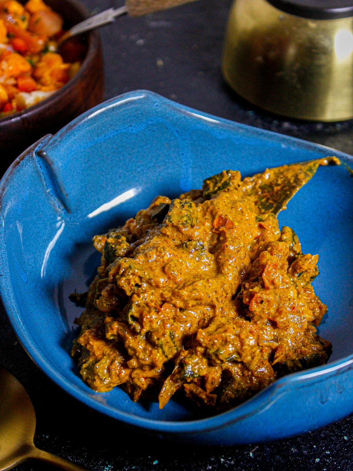 Delicious Bengali Shorshe Bhindi served in a blue bowl