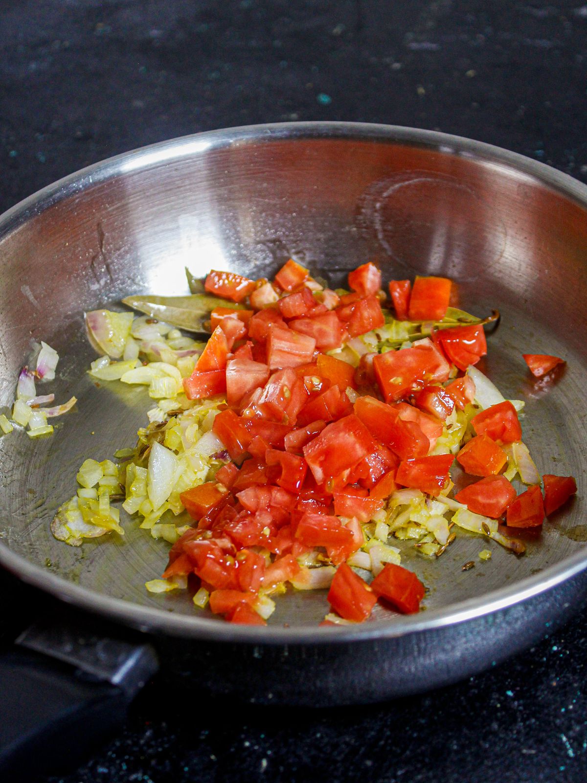 Add chopped tomatoes to the saute and mix well
